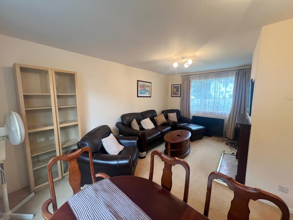Lot: 74 - THREE-BEDROOM HOUSE FOR IMPROVEMENT - Living/dining room with furniture